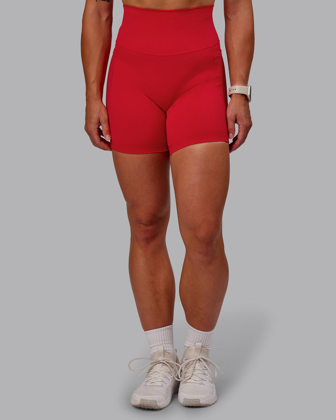 Woman wearing Elixir Mid Short Tight With Pockets in Flame | Size:S