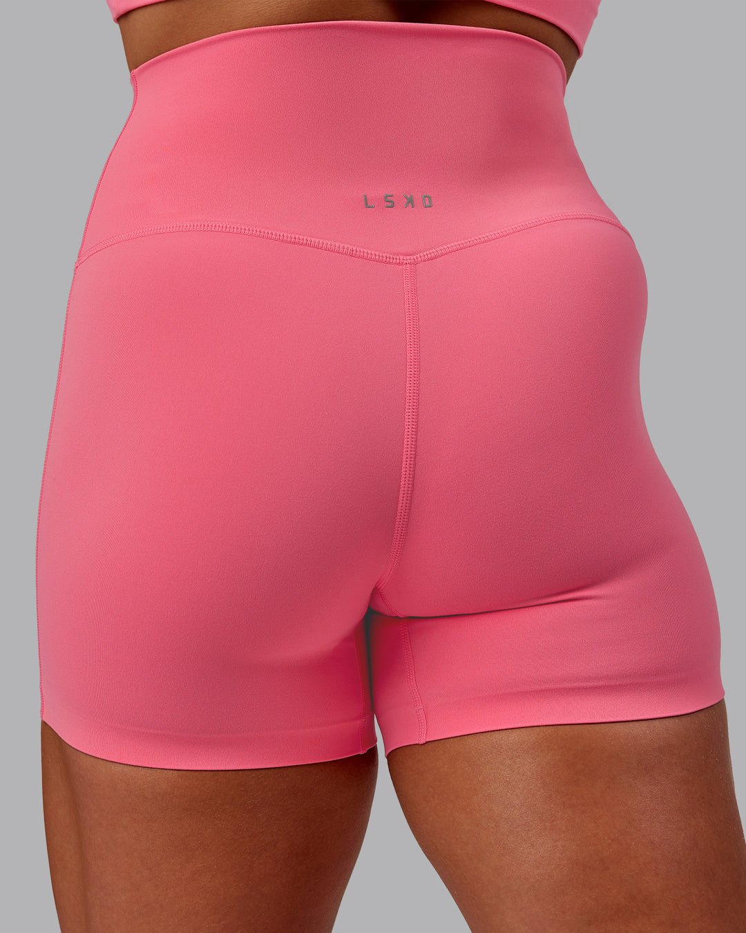 Woman wearing Elixir X-Short Tight in Pink Lemonade | Size:S