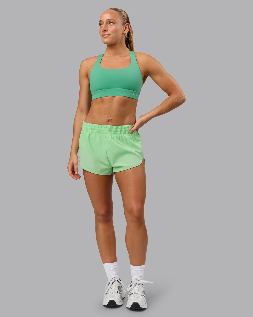 Woman wearing Energy 1.8&quot; Training Shorts - Surreal Green