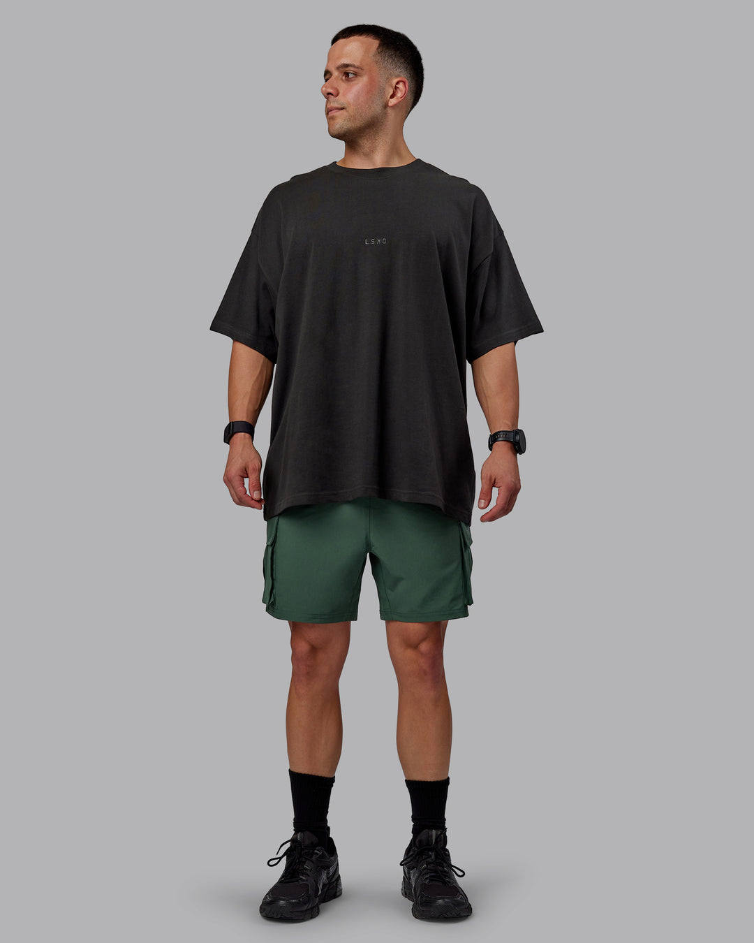 Man wearing Energy Stretch Performance Cargo Shorts - Cilantro