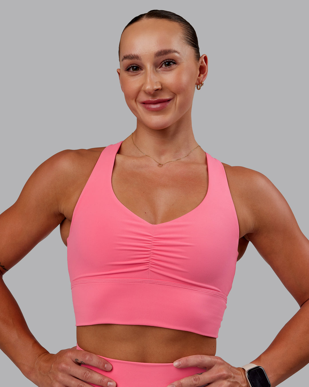 Woman wearing Evoke Sports Bra in Pink Lemonade | Size:S