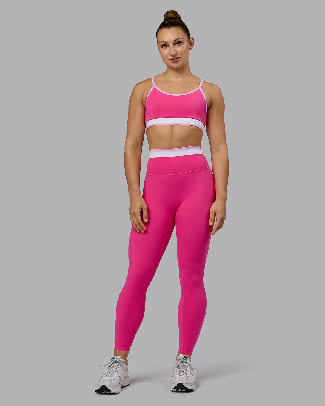 Woman wearing Excel Full Length Tights - Ultra Pink