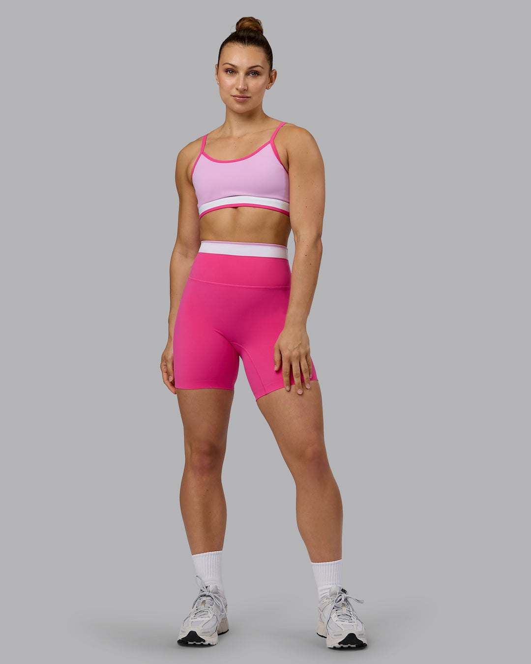 Woman wearing Excel Mid Short Tights - Ultra Pink