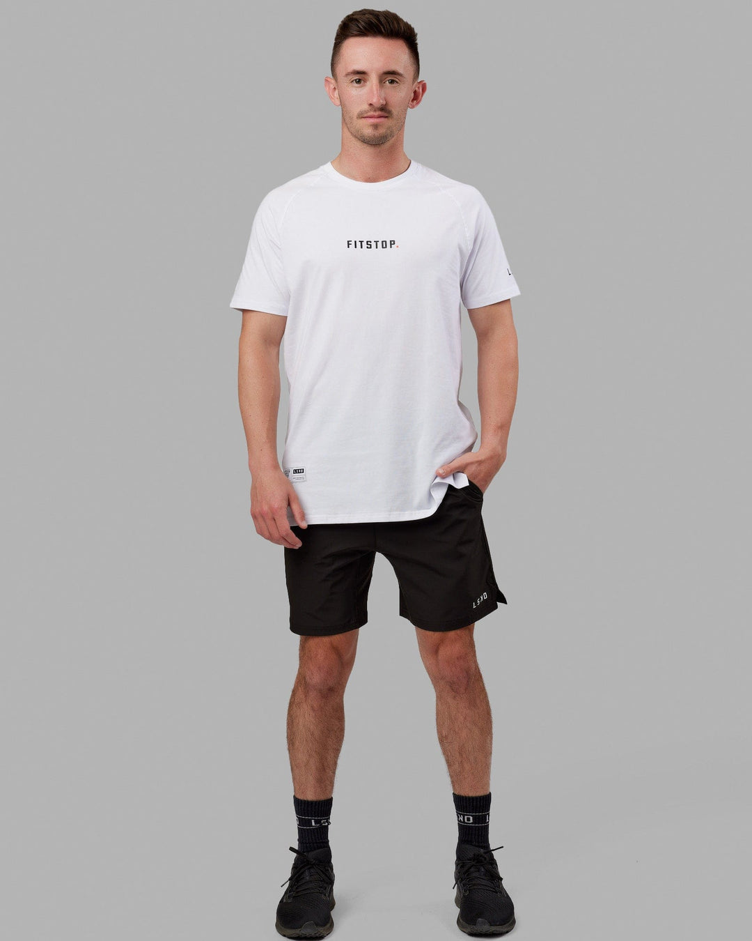 Man wearing Fitstop Optimal Tee - White