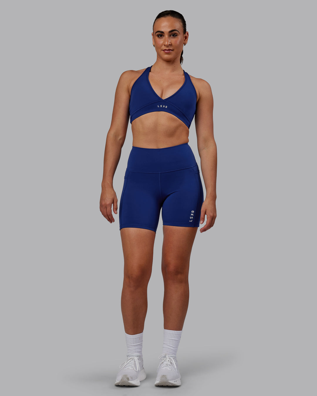 Woman wearing Flux Mid Short Tights - Midnight Blue