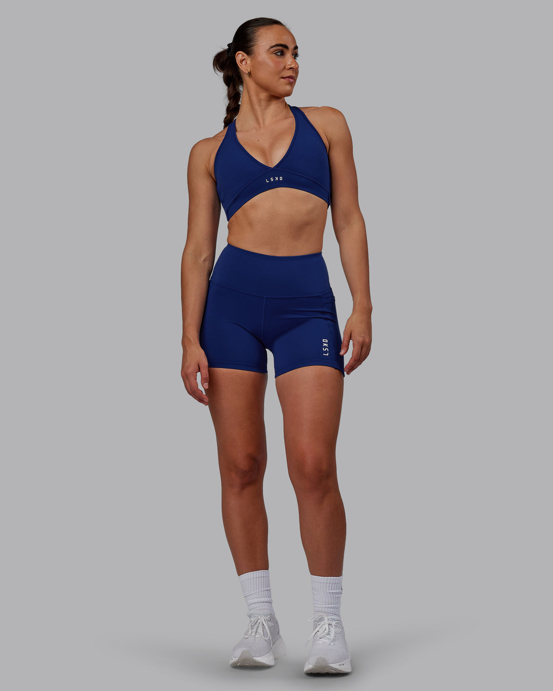 Woman wearing Flux X Short Tights - Midnight Blue