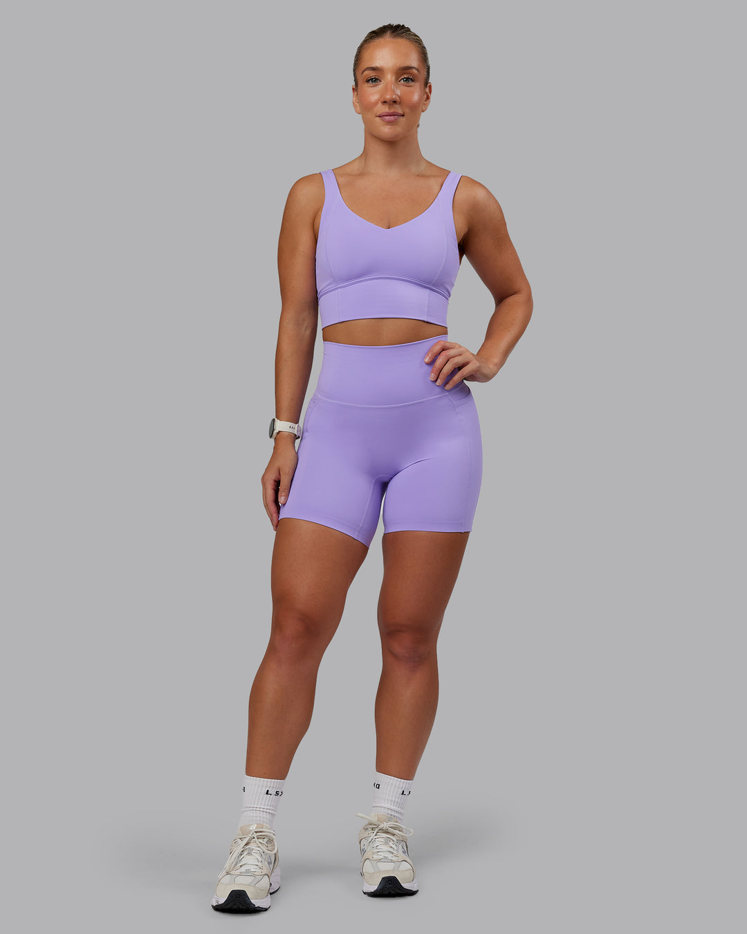 Woman wearing Function Longline Sports Bra in Violet Ray | Size:S