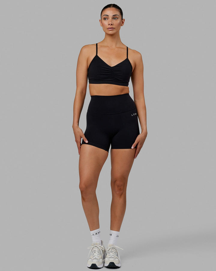 Woman wearing Fundamental Sports Bra - Black
