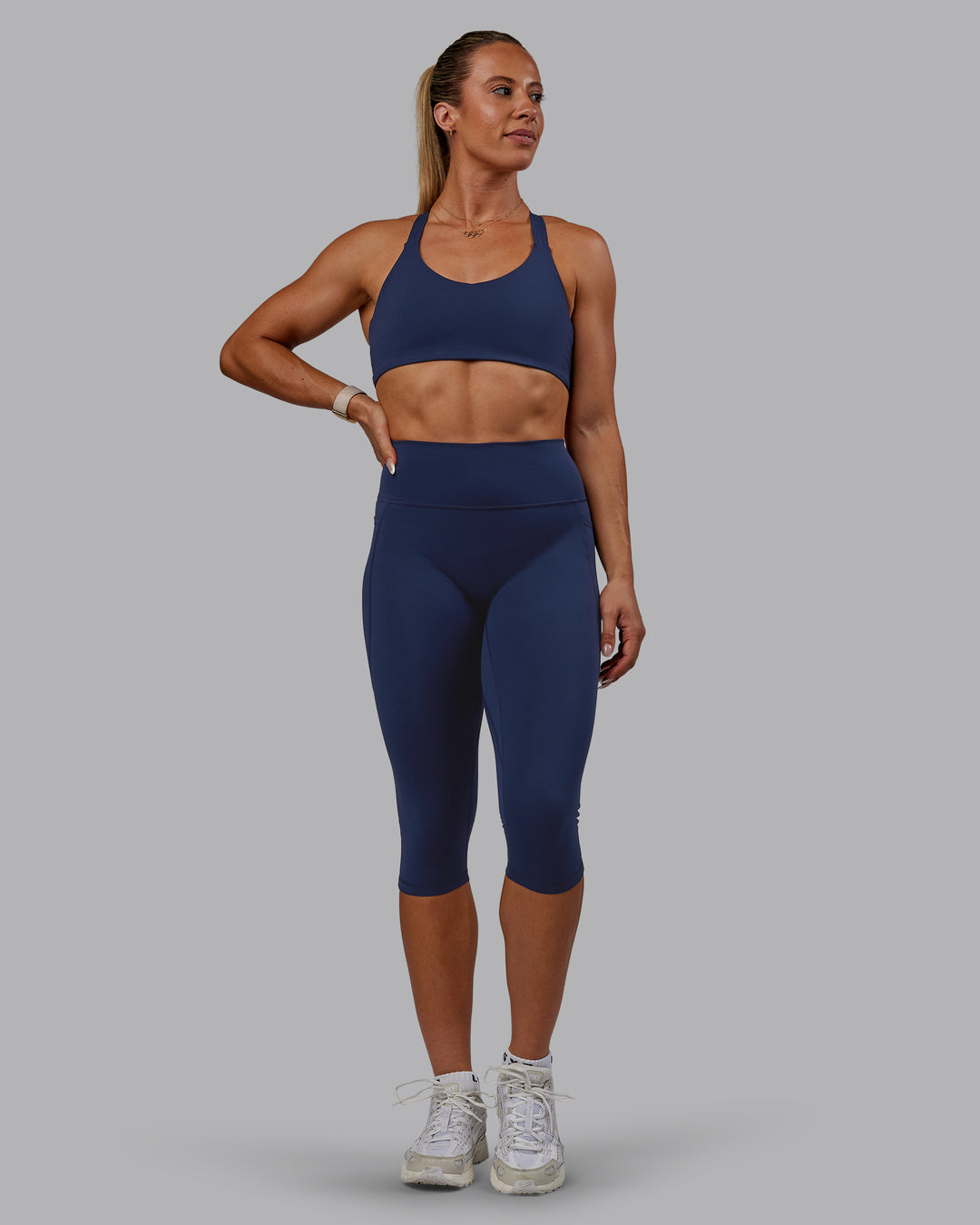 Woman wearing Fusion 3/4 Length Tights with Pockets - Future Navy