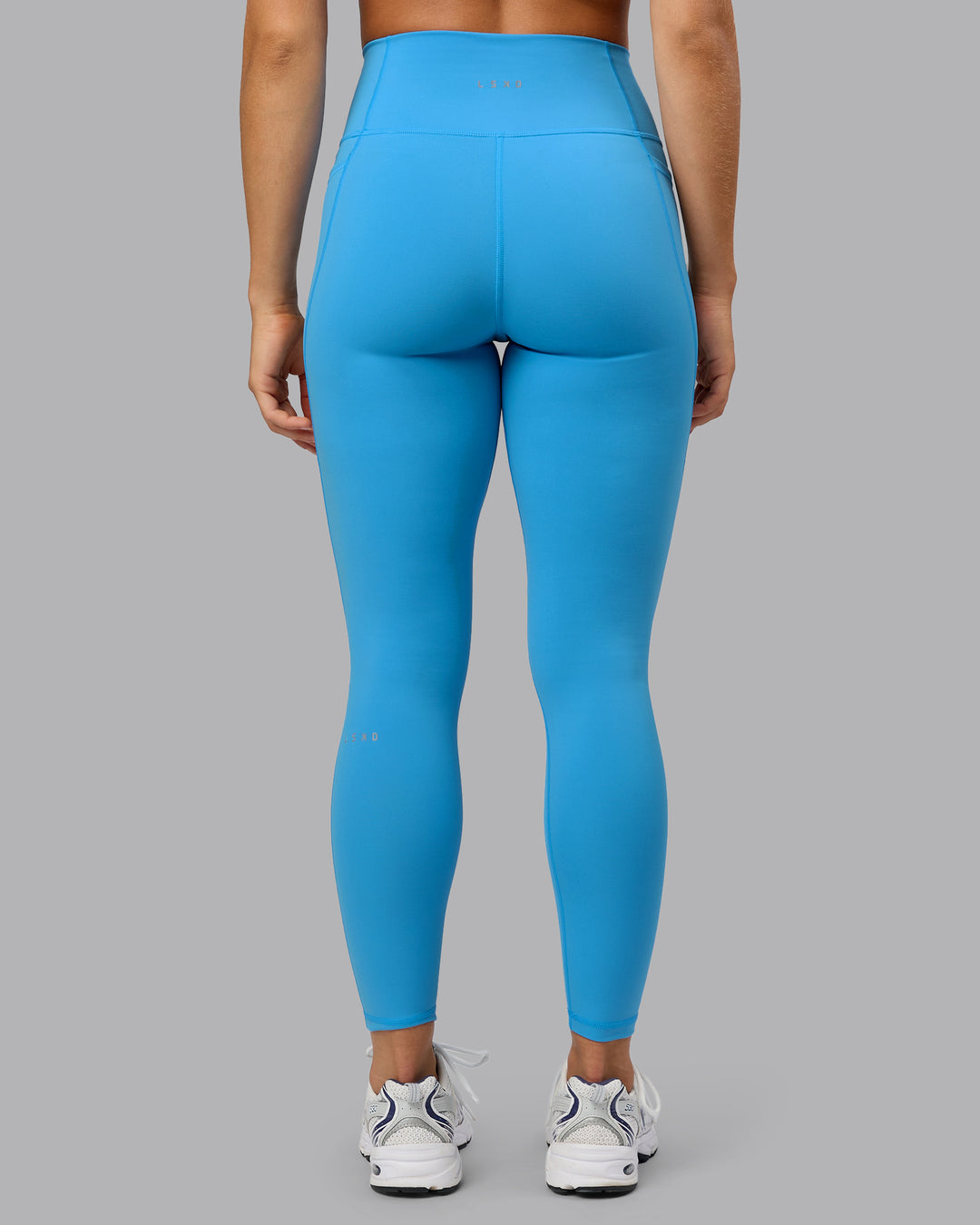 Woman wearing Fusion Full Length Tights with Pockets in Azure Blue | Size:S