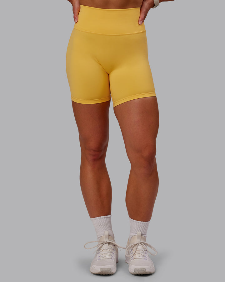 Woman wearing Fusion Mid Short Tight in Banana Cream | Size:S
