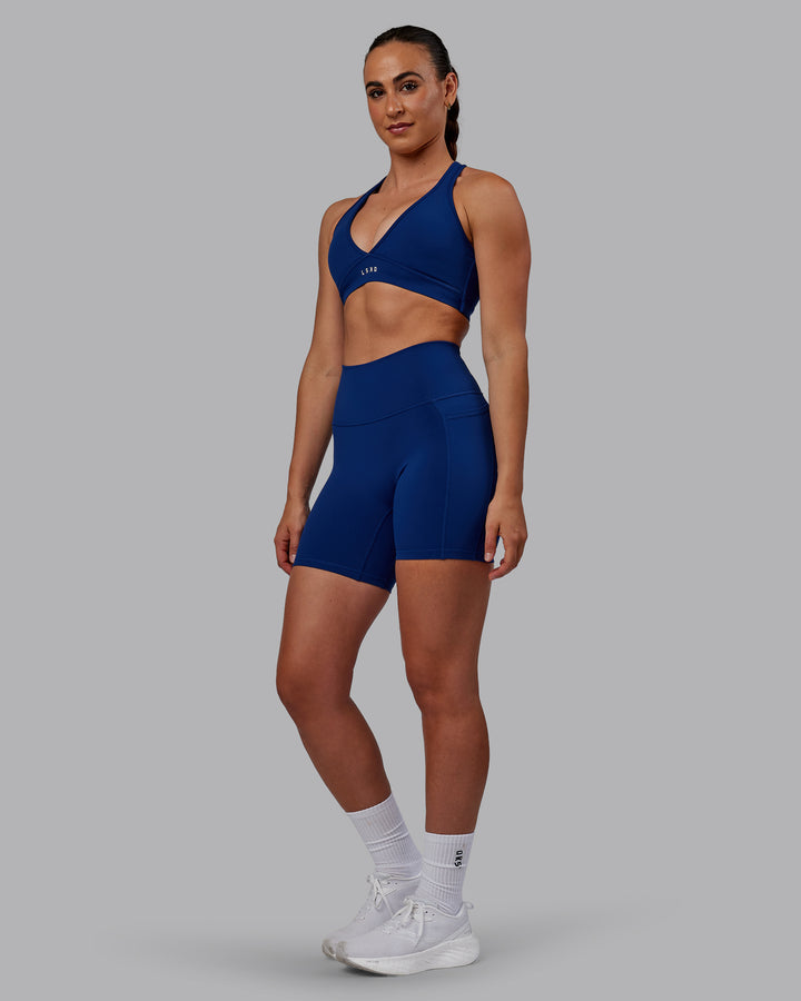 Woman wearing Fusion Mid Short Tights - Midnight Blue
