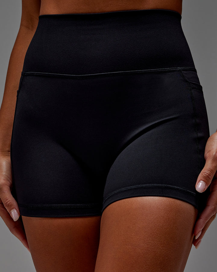 Woman wearing Fusion X-Short Tight With Pockets in Black | Model:Demi | Size:S
