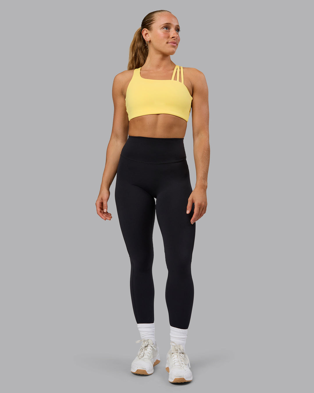 Woman wearing Galvanise Sports Bra - Lemon