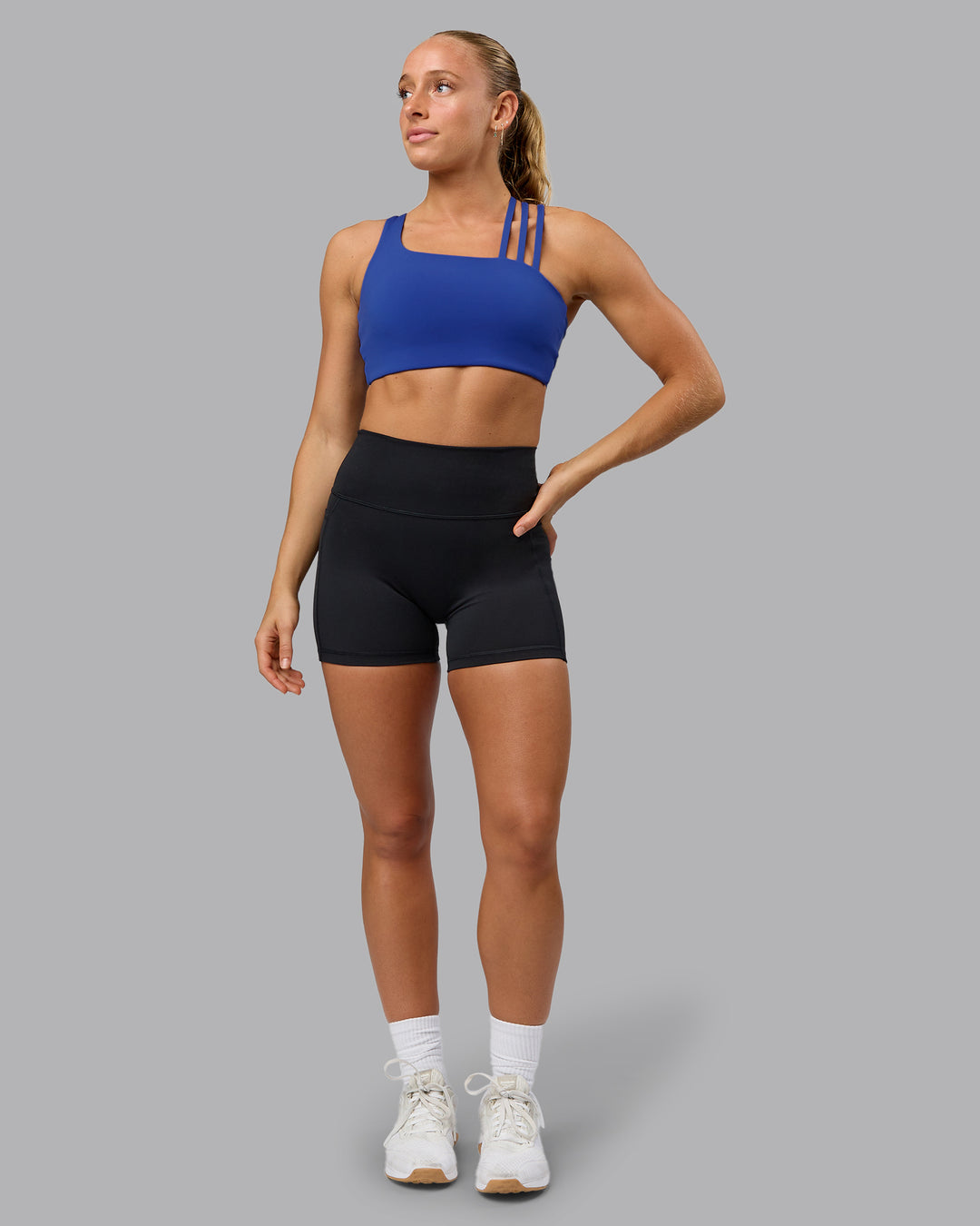 Woman wearing Galvanise Sports Bra - Power Cobalt