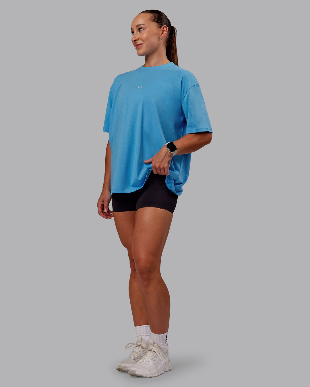 Woman wearing Go-To FLXCotton Oversized Tee in Azure Blue-White | Size:S