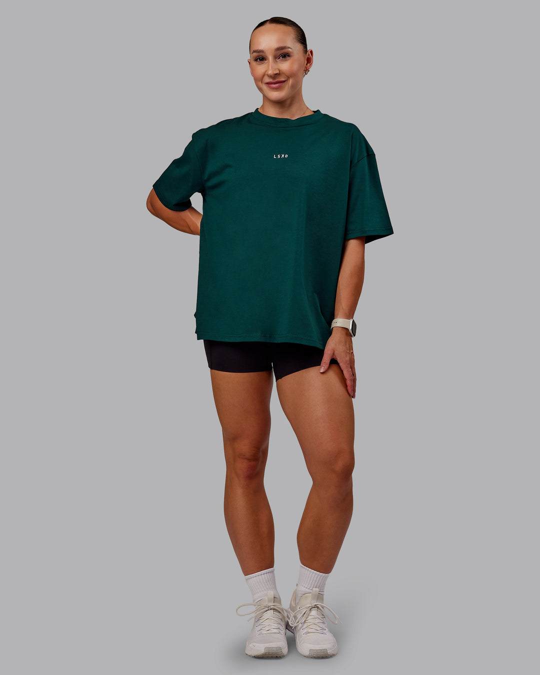 Woman wearing Go-To FLXCotton Oversized Tee in Dark Moss-White | Size:S