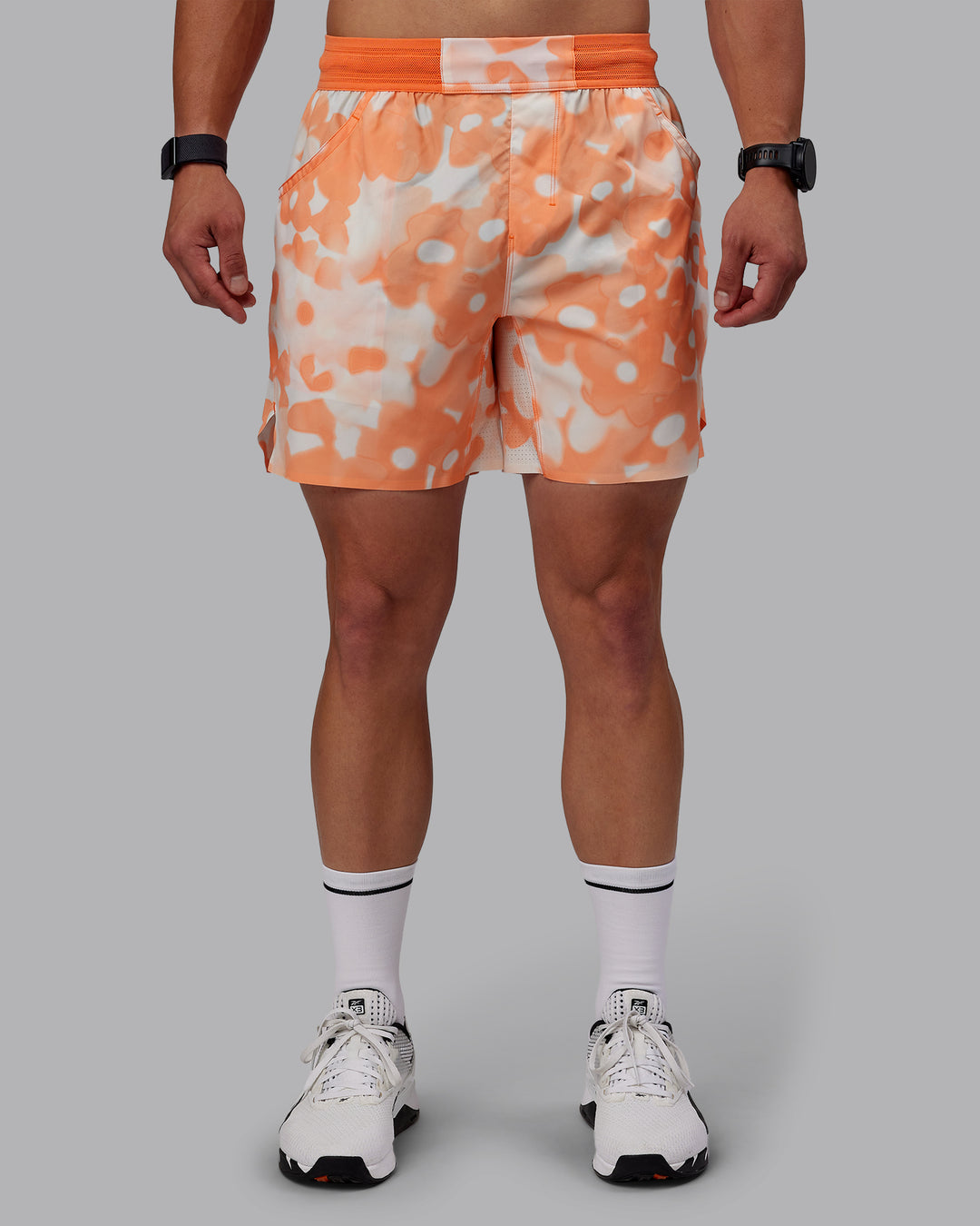 Man wearing Grand Slam 6&quot; Shorts in Wildflower Cantaloupe | Size:S