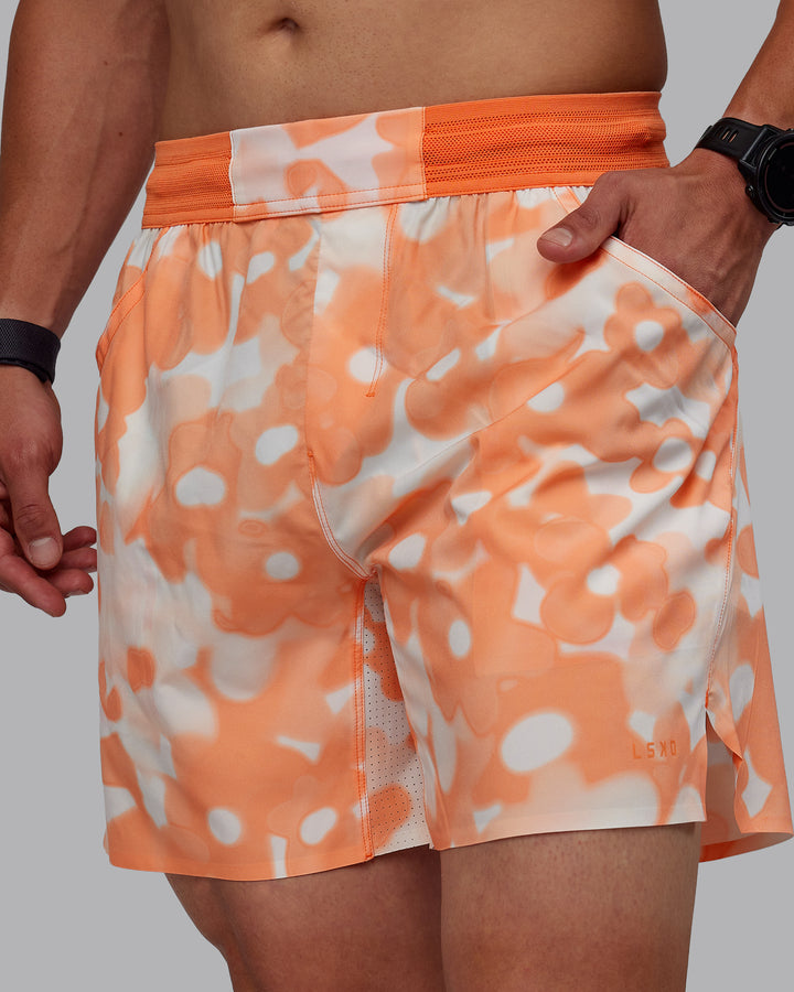 Man wearing Grand Slam 6&quot; Shorts in Wildflower Cantaloupe | Size:S
