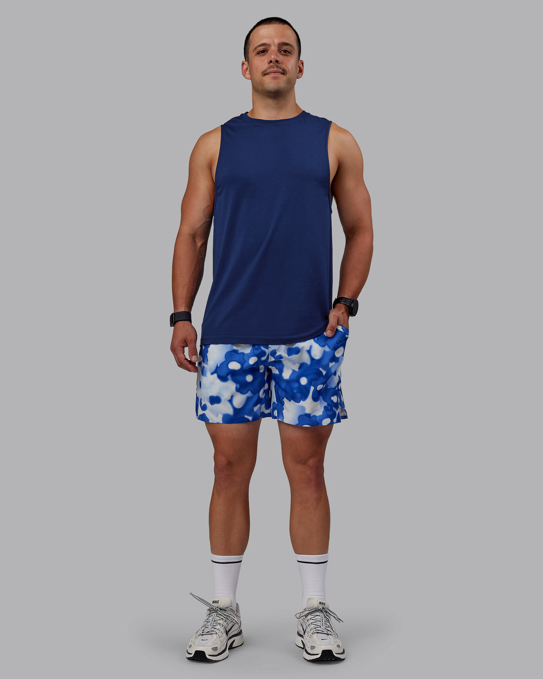 Man wearing Grand Slam 6&quot; Shorts in Wildflower Midnight Blue | Size:S