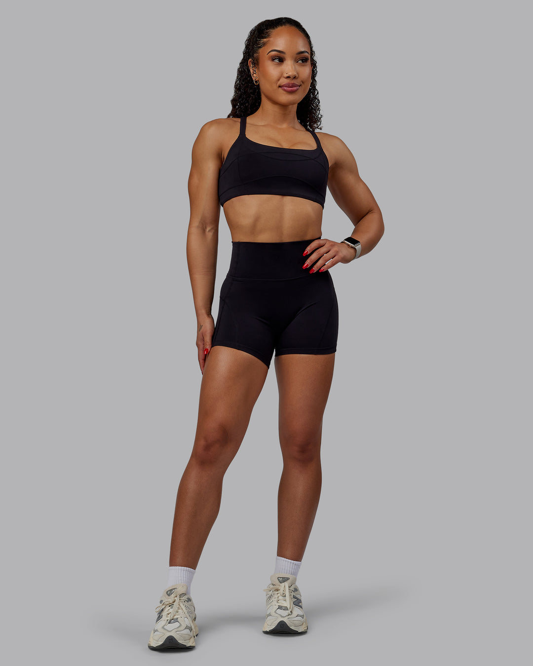 Woman wearing Inertia Sports Bra - Black