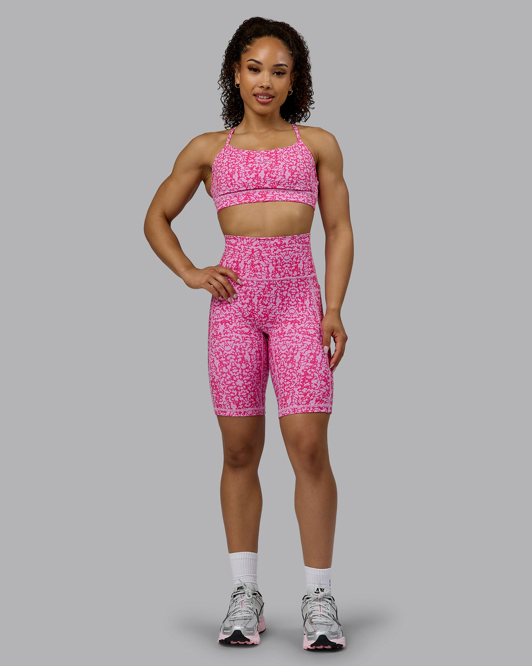 Woman wearing Lift Sports Bra - Patina-Ultra Pink