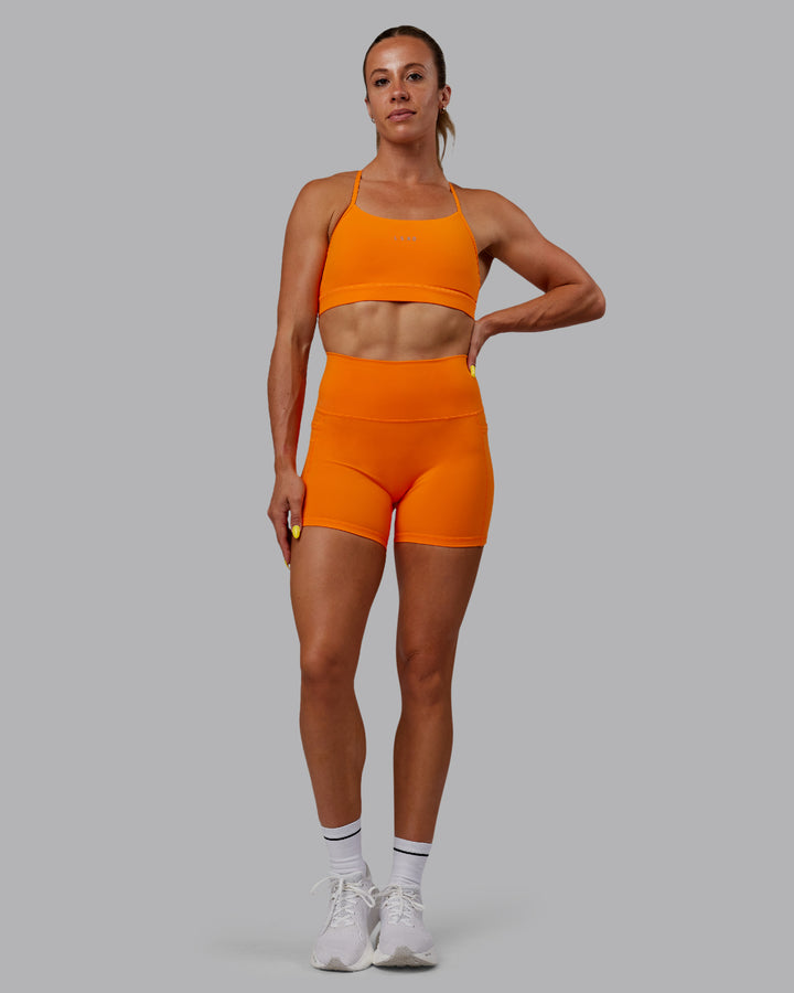 Woman wearing Lift Sports Bra - Vibrant Orange
