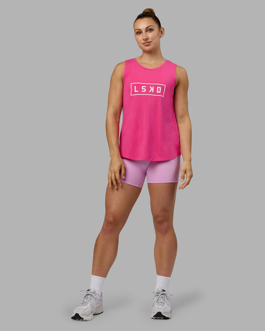 Woman wearing Luna FLXCotton Longline Tank - Ultra Pink-White