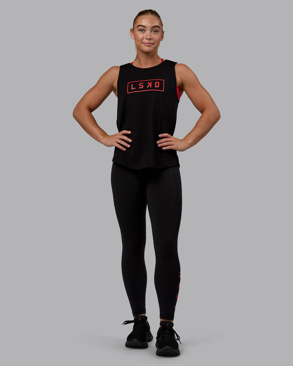 Woman wearing Luna FLXCotton Longline Tank - Black-Crimson