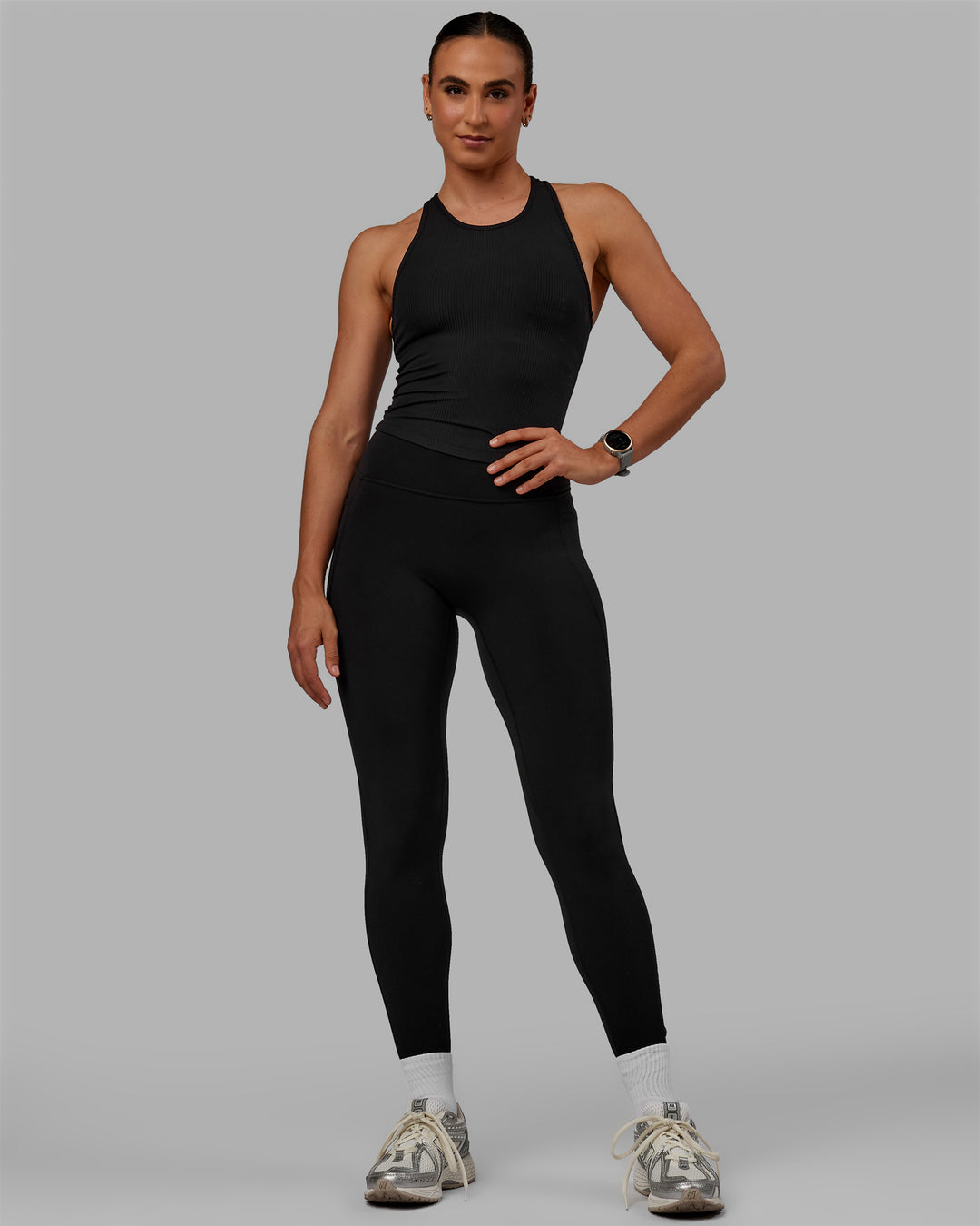 Woman wearing Luxe Ribbed Flow Shelf Bra Performance Tank - Black