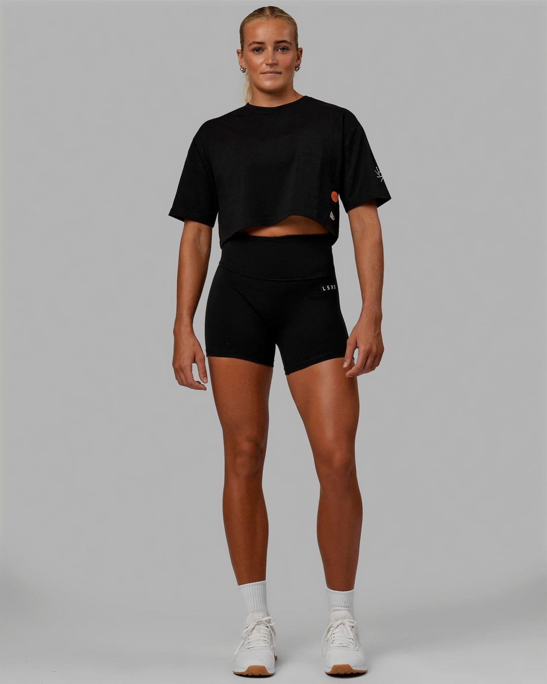 Woman wearing Millennium FLXCotton Cropped Tee - Black