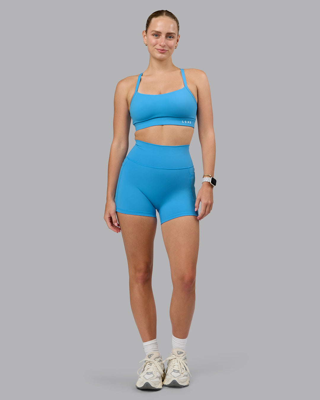 Woman wearing Momentum Sports Bra (D/DD/E) in Azure Blue | Size:S