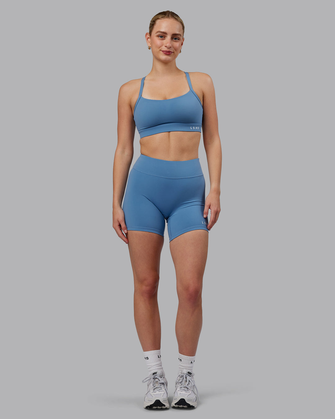 Woman wearing Momentum Sports Bra (D/DD/E) - Elemental Blue