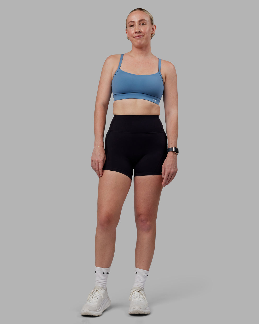 Woman wearing Momentum Sports Bra (D/DD/E) - Elemental Blue