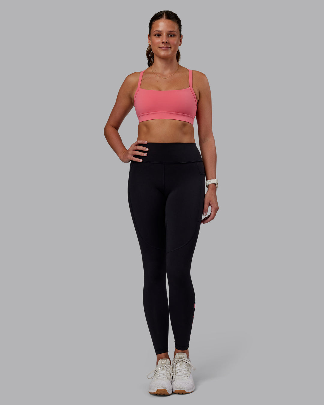 Woman wearing Momentum Sports Bra - Pink Lemonade | Model:Phoebe | Size:S