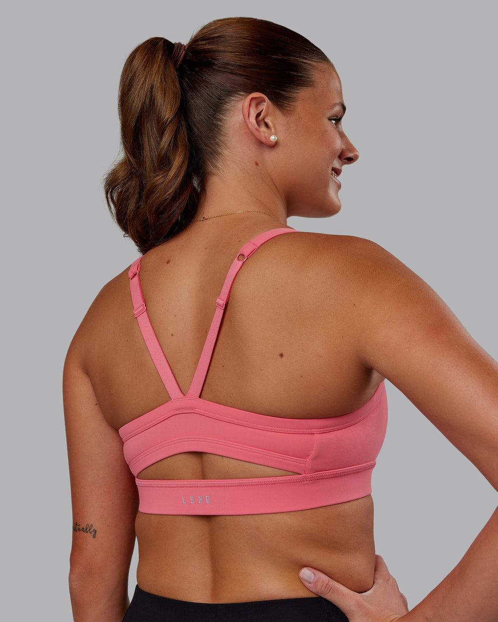 Woman wearing Momentum Sports Bra - Pink Lemonade | Model:Phoebe | Size:S