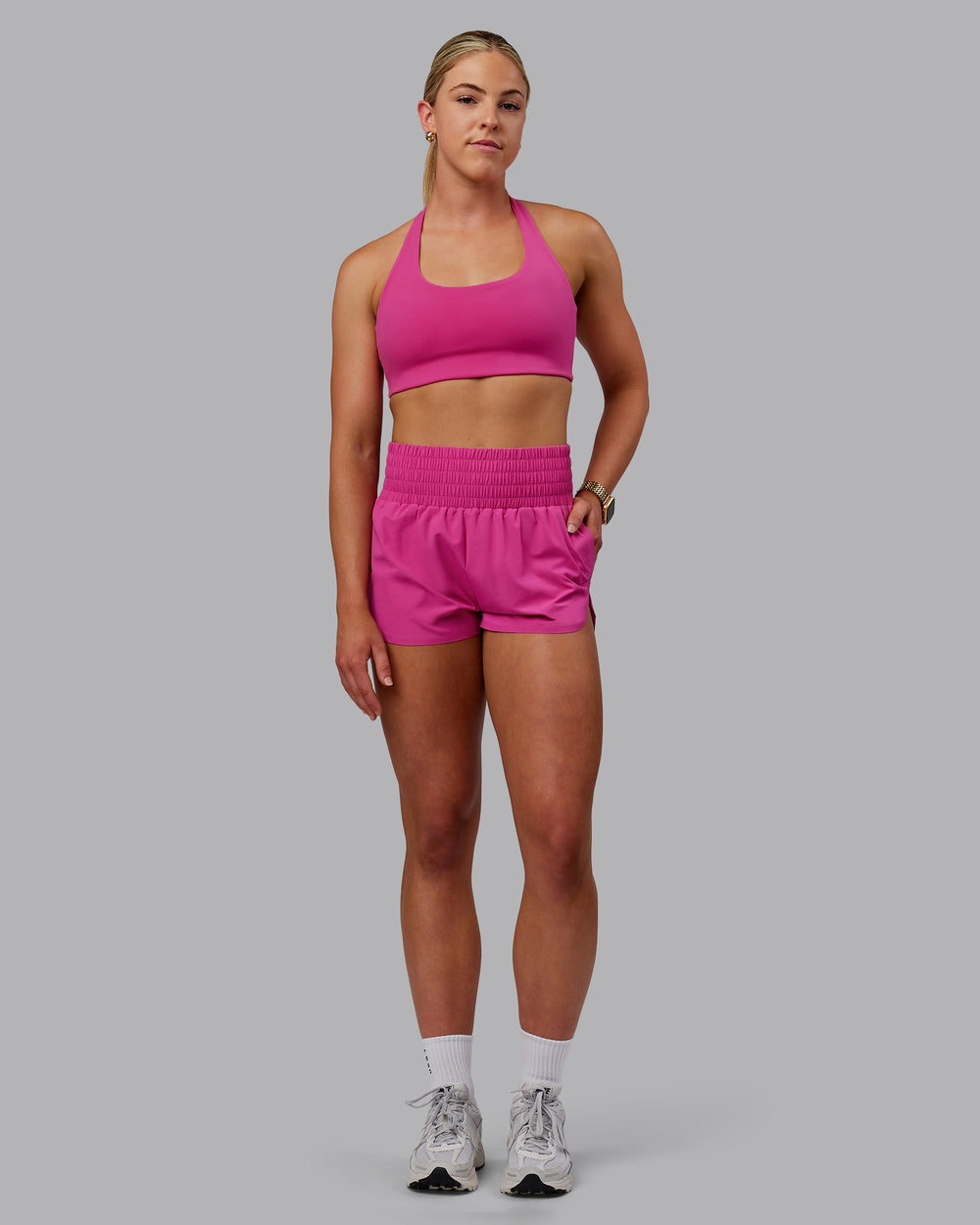 Woman wearing Power Train Shorts - Fuchsia Pink