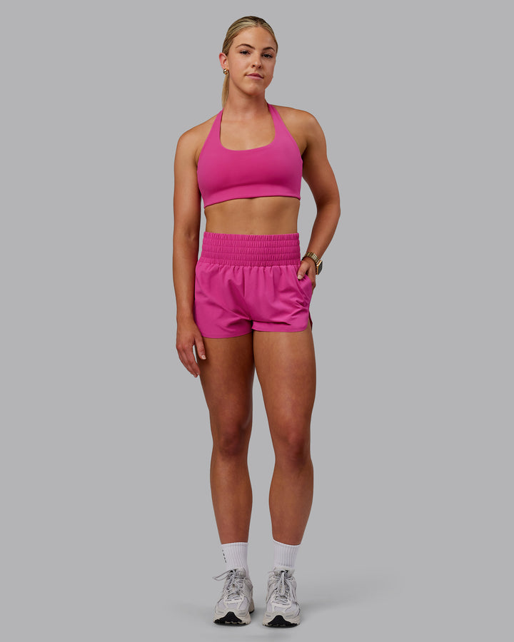 Woman wearing Power Train Shorts - Fuchsia Pink
