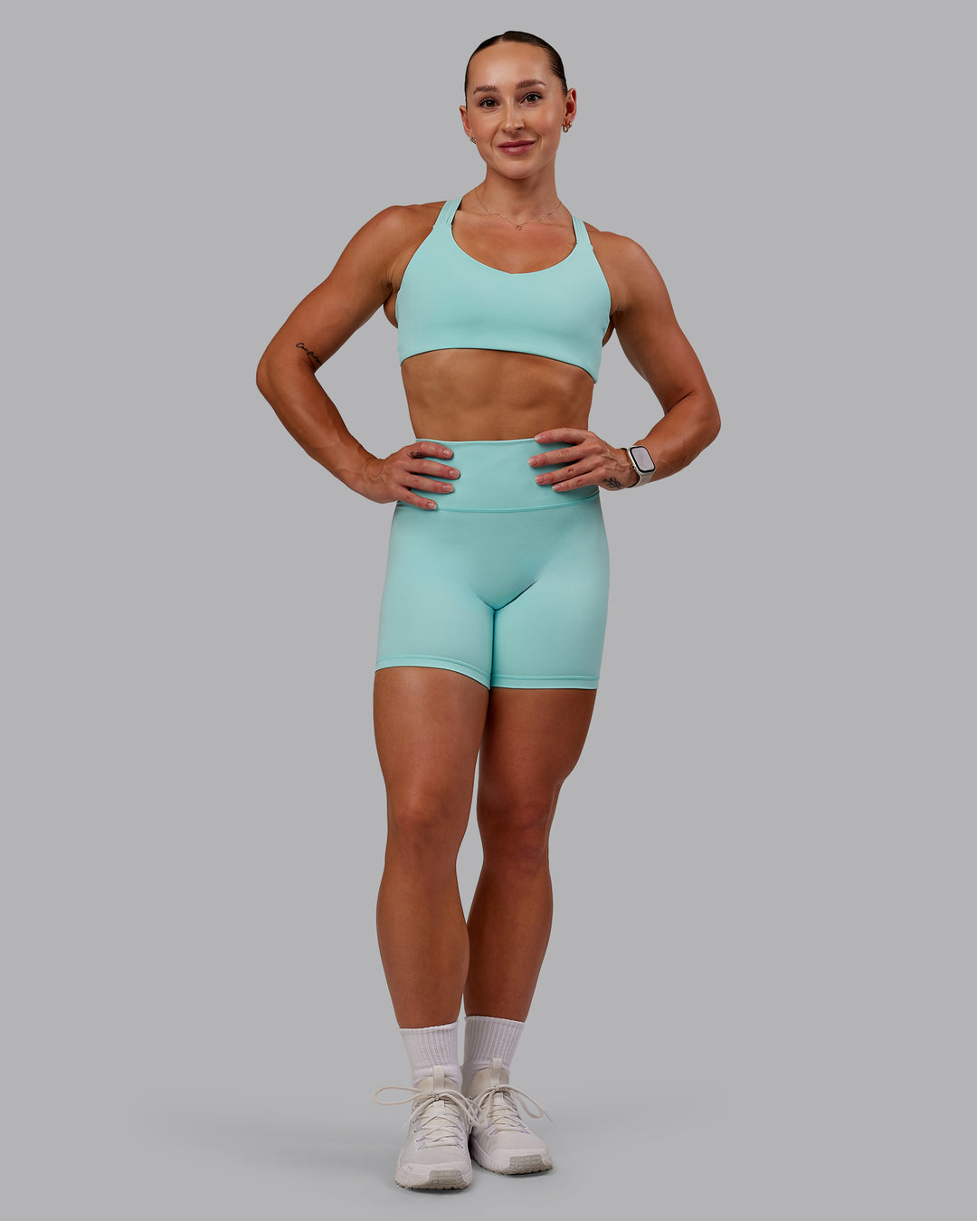 Woman wearing Push The Limit Sports Bra in Island Paradise | Size:S