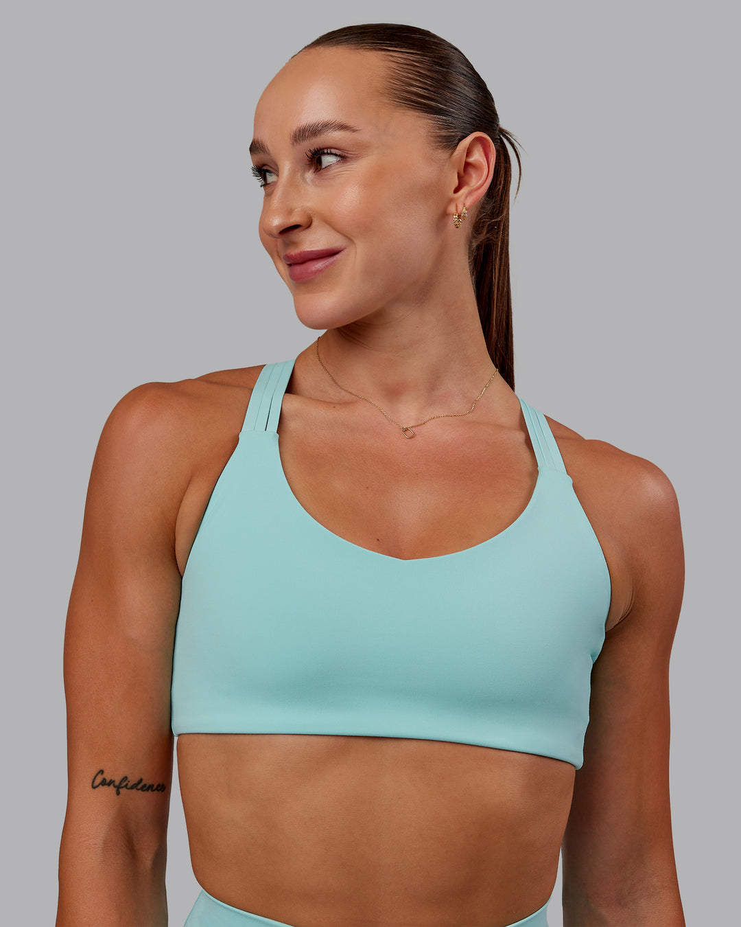 Woman wearing Push The Limit Sports Bra in Island Paradise | Size:S