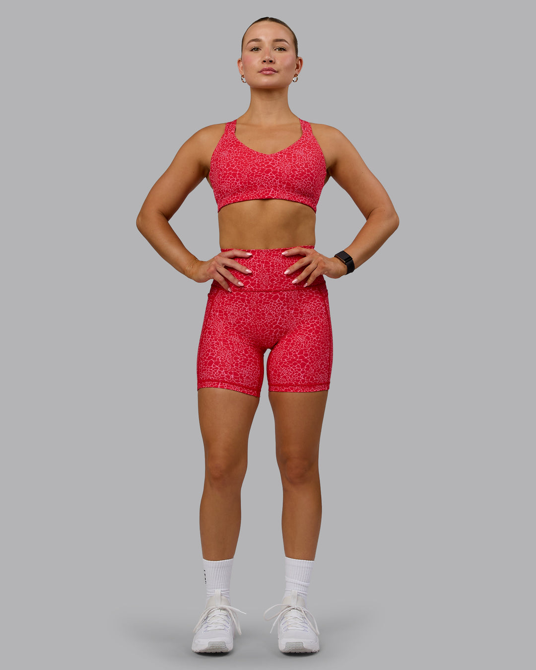 Woman wearing Push The Limit Sports Bra - Red Vitality Print