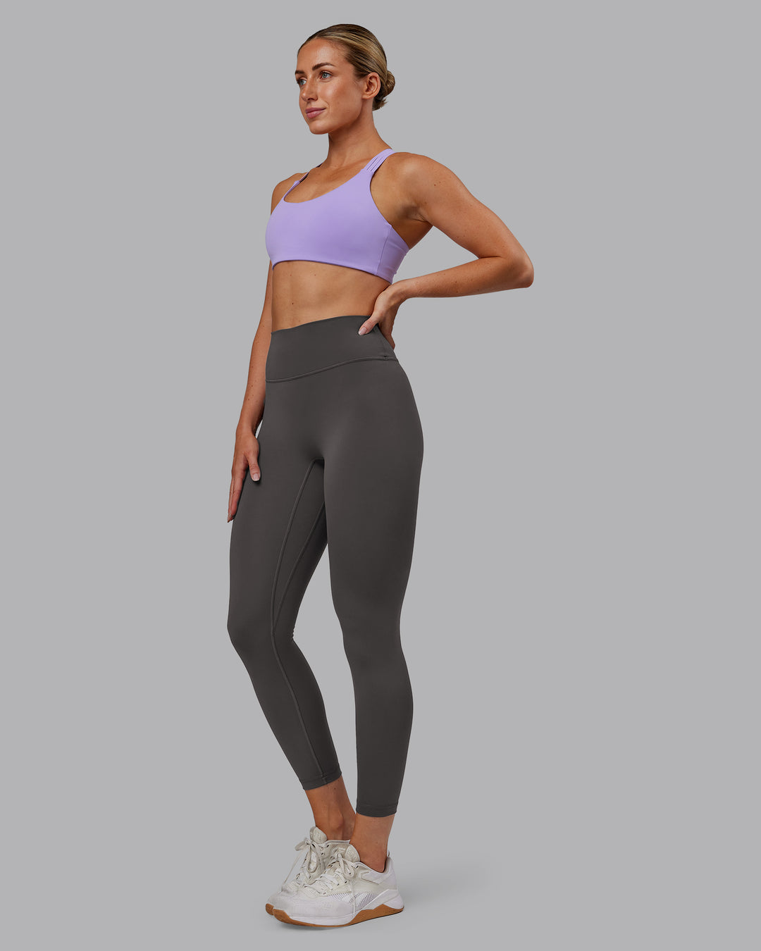 Woman wearing Push The Limit Sports Bra - Violet Ray | Model:Paris | Size:S