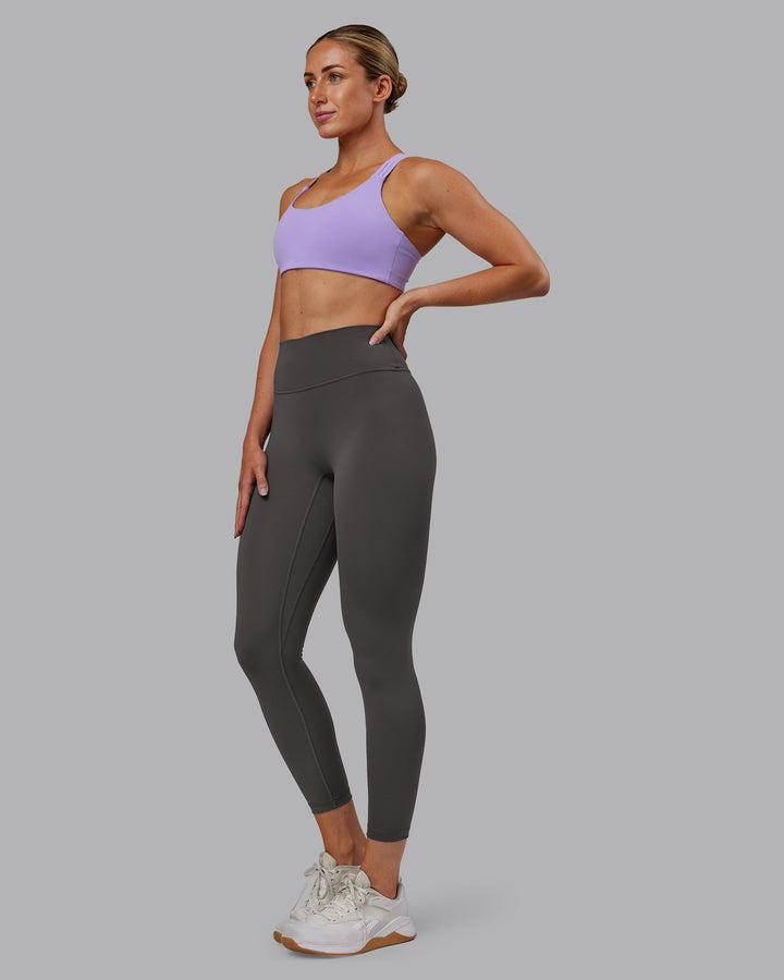 Woman wearing Push The Limit Sports Bra - Violet Ray | Model:Paris | Size:S
