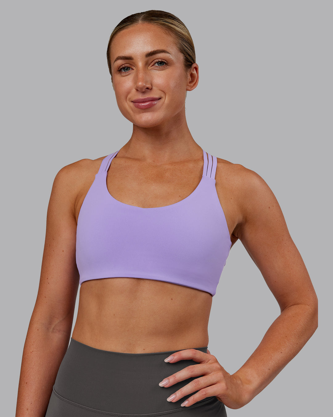 Woman wearing Push The Limit Sports Bra - Violet Ray | Model:Paris | Size:S