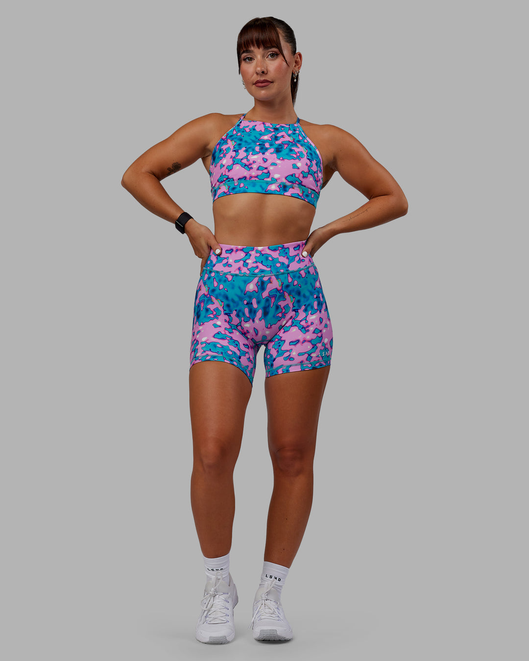 Woman wearing RXD Mid Short Tights - Neon Camo