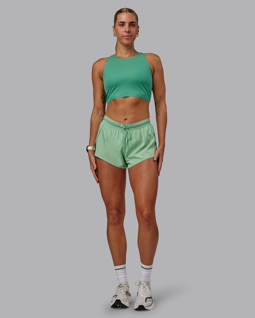 Woman wearing Race Day Cropped Performance Tank - Mystic Green-Surreal Green