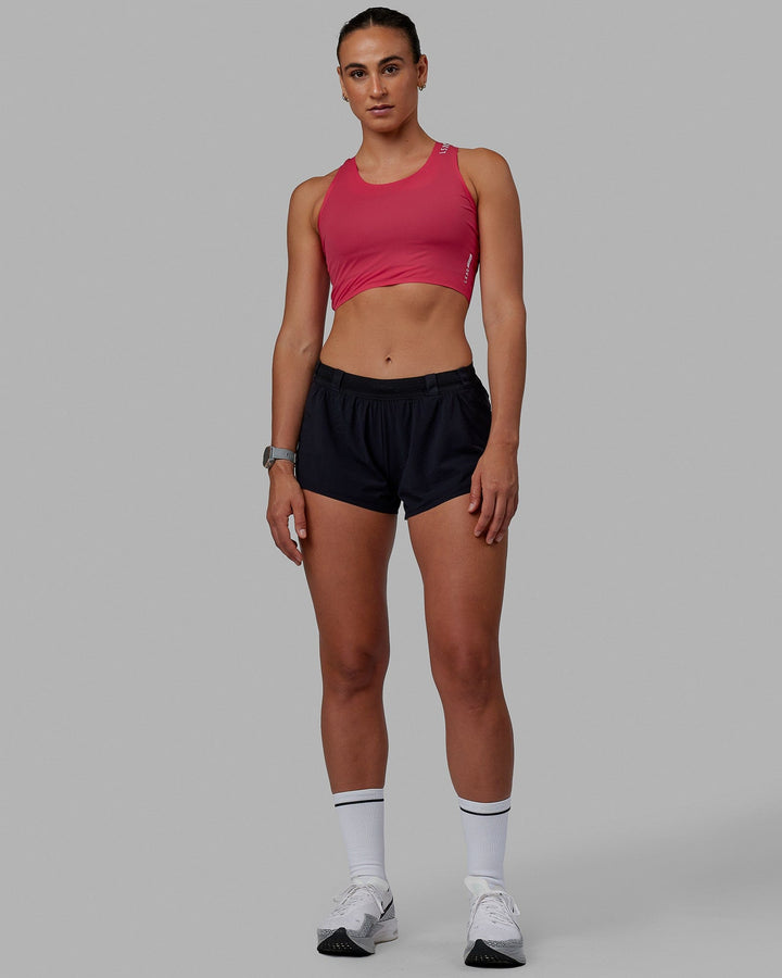 Woman wearing Race Day Cropped Performance Tank - Raspberry-White
