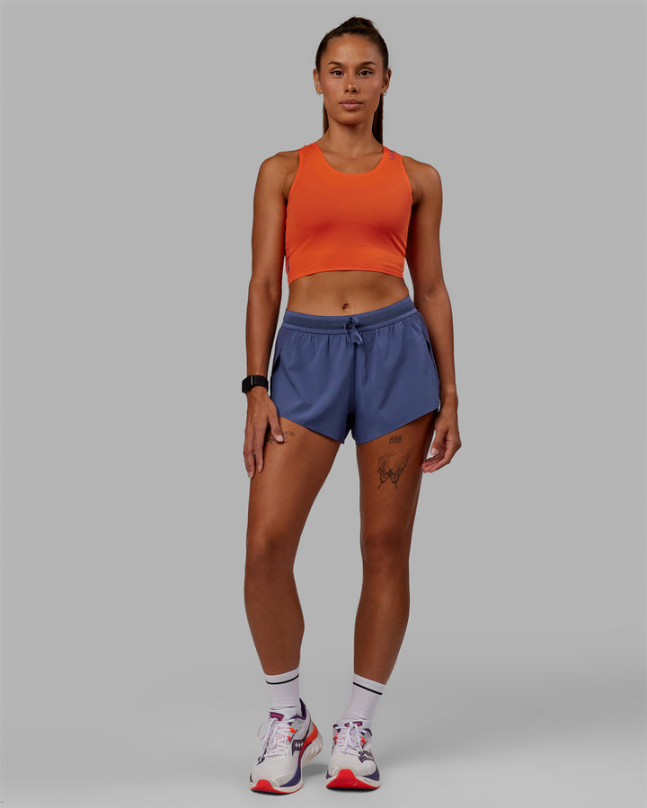 Woman wearing Race Day Cropped Performance Tank - Ultra Orange-Future Dusk
