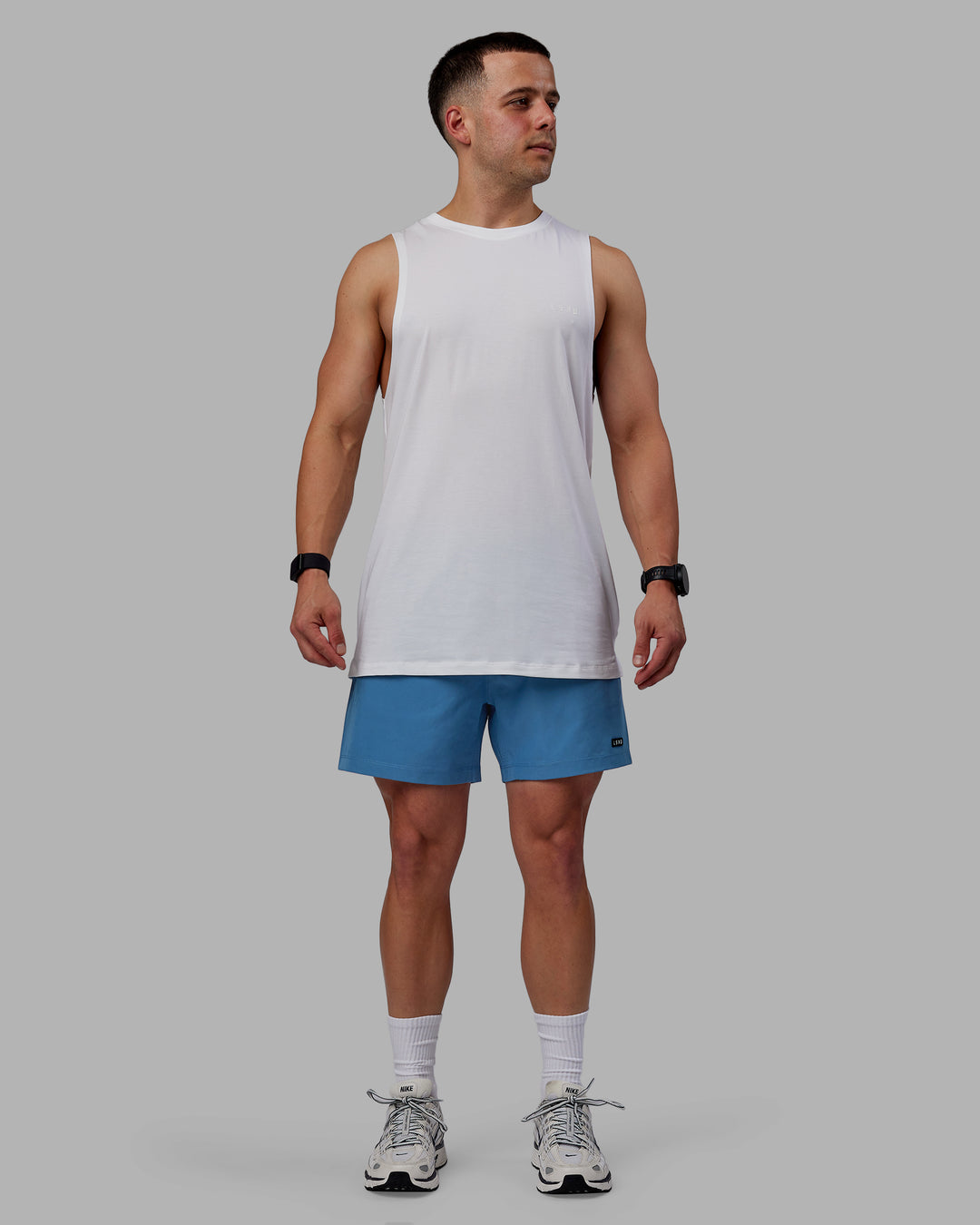 Man wearing Rep 5&quot; Lined Performance Shorts - Elemental Blue