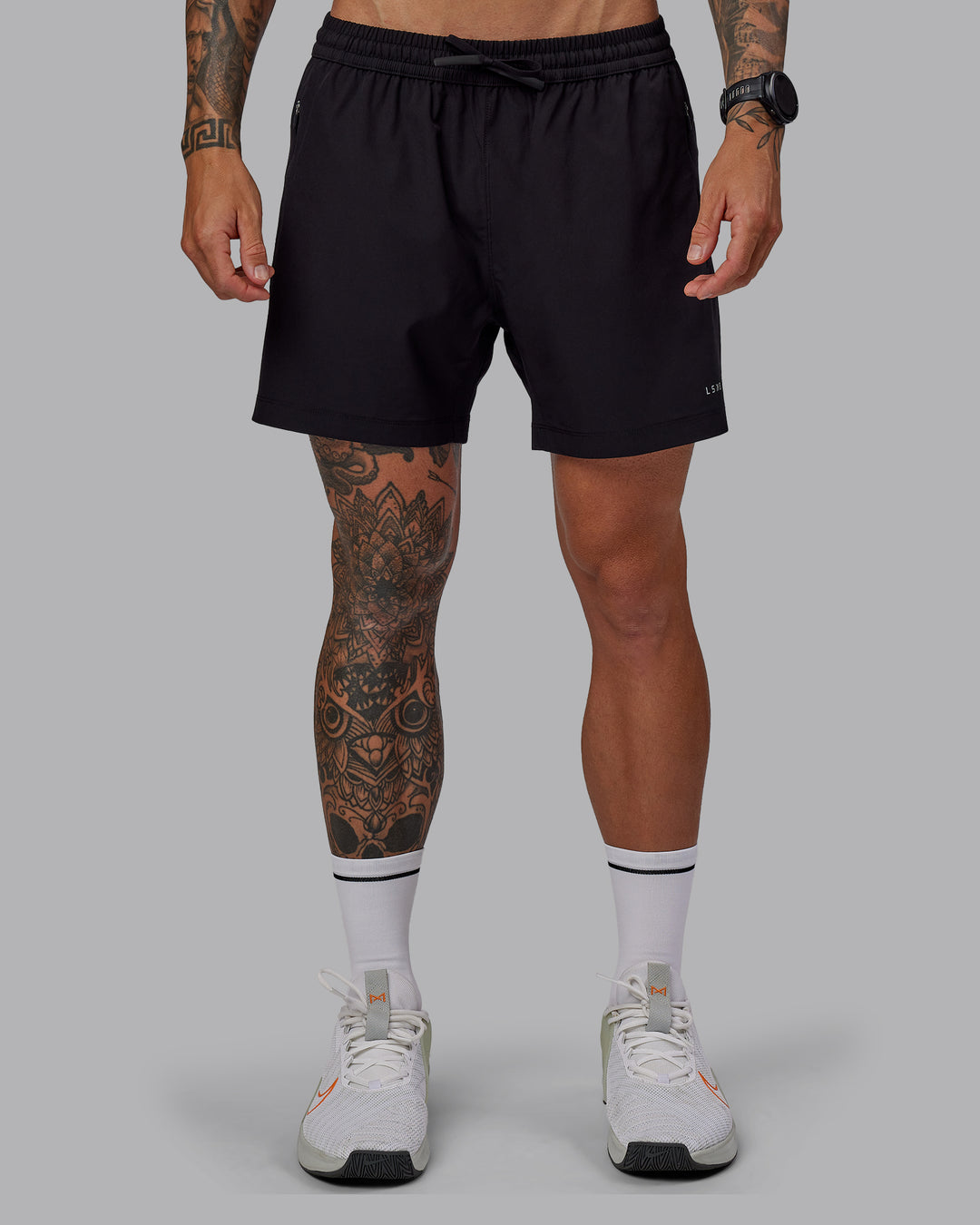 Man wearing Rep 5&quot; Lined Performance Shorts in Black | Size:S